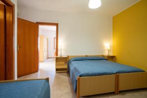 Posteľ alebo postele v izbe v ubytovaní Testa di Monaco - Basic Beach Accommodations