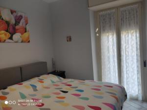 Posteľ alebo postele v izbe v ubytovaní Casa Vacanze Zia Rose