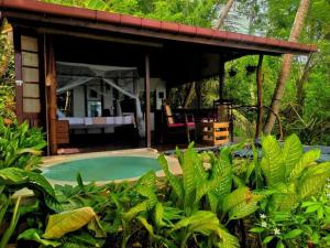 a resort with a pool and a pavilion at TS2W See More Beach Treehouse in Matara