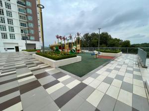a playground in the middle of a building at Camellia Mesahill Homestay in Nilai