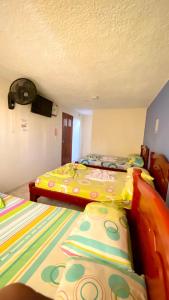 Letto o letti in una camera di Hotel Turista Real