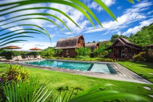 an image of a house with a swimming pool at Villa Ellya Areguling, for 8-10 Pax in Kuta Lombok