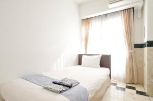 Postel nebo postele na pokoji v ubytování Hotel Imalle Yokohama Isezakicho