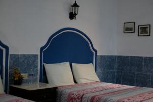 Letto o letti in una camera di Posada Ya´ax Ich