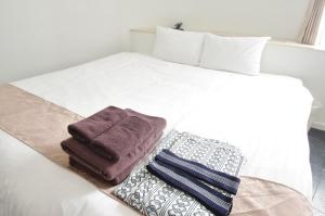 Postel nebo postele na pokoji v ubytování Hotel Imalle Yokohama Isezakicho