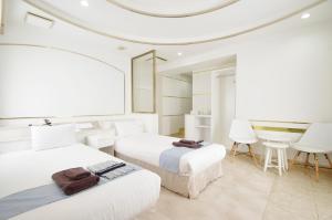 Postel nebo postele na pokoji v ubytování Hotel Imalle Yokohama Isezakicho