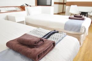 Postel nebo postele na pokoji v ubytování Hotel Imalle Yokohama Isezakicho