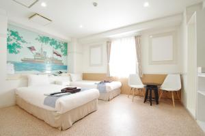 Voodi või voodid majutusasutuse Hotel Imalle Yokohama Isezakicho toas +37 fotot