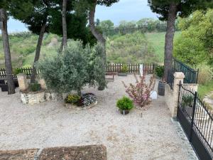 a garden with a fence and some plants and trees at Casa Berardi Residenza Storica in Ortona