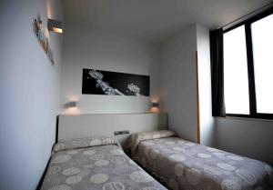 Posteľ alebo postele v izbe v ubytovaní Hotel Ciutat De Sant Adria