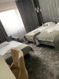 Postel nebo postele na pokoji v ubytování Hotel & Spa Biały Dom