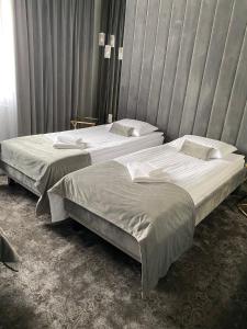 Postel nebo postele na pokoji v ubytování Hotel & Spa Biały Dom