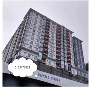 a tall building with a thought bubble in front of it at Cameron Emerald Avenue @ Brinchang in Cameron Highlands
