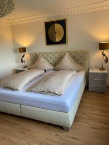Ένα ή περισσότερα κρεβάτια σε δωμάτιο στο Ferienwohnung Haus Weitblick
