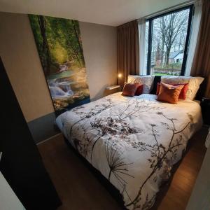 Giường trong phòng chung tại Enjoy Heuvelland
