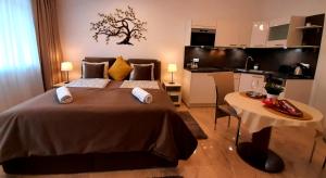 Posteľ alebo postele v izbe v ubytovaní Nobless Apartments Holedná Brno