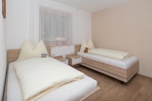 Postel nebo postele na pokoji v ubytování Wiedmairhof