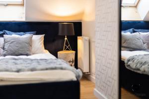 Postel nebo postele na pokoji v ubytování Liliowy Apartament + 19 fotografií