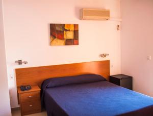 Postel nebo postele na pokoji v ubytování Hotel L'Escala