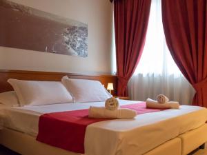 Postel nebo postele na pokoji v ubytování Hotel Venezia Park - ENJOY HOLIDAY