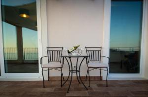 two chairs and a table on a porch at Villa Ragusa in Dubrovnik