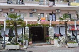 a building with a statue on top of it at Artemis in Paralia Katerinis