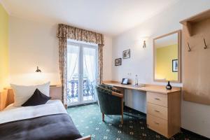 Postel nebo postele na pokoji v ubytování Hotel Bellevue