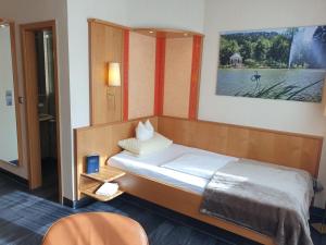 Postel nebo postele na pokoji v ubytování Hotel Koch