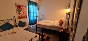 A bed or beds in a room at Atlantic Hostel