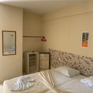 Postel nebo postele na pokoji v ubytování CALDAS PALACE HOTEL JORRO + 37 fotografií