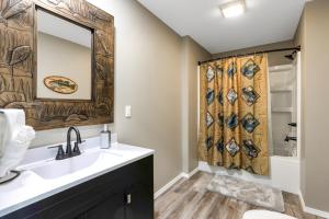 a bathroom with a sink and a shower at Waterfront Retreat at Rockaway with Fishing Dock home in Rockaway Beach