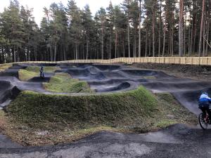 two people riding bikes in a skate park at Ventoux in Aviemore