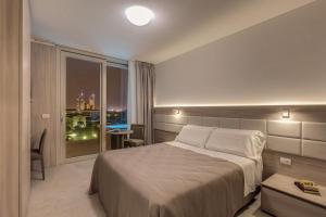 Postel nebo postele na pokoji v ubytování Sunrise Palace