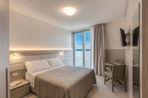 Postel nebo postele na pokoji v ubytování Sunrise Palace