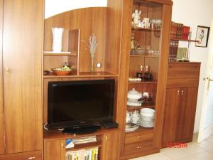 TV i/ili multimedijalni sistem u objektu Apartment Bella