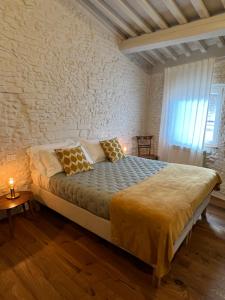a bedroom with a large bed in a room at Casa Giulia in Siena