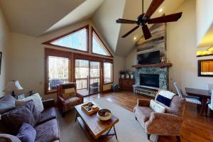 a living room with a couch and a fireplace at Sawatch Townhouse C8 in Edwards