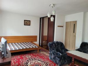 Posteľ alebo postele v izbe v ubytovaní Panterej Pokoje Gościnne