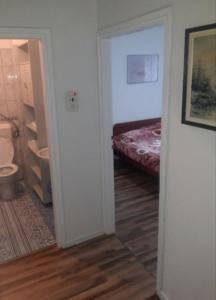 เตียงในห้องที่ ANI Apartments Banja Luka