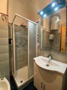 a bathroom with a shower and a sink and a toilet at Appartamento a Pescocostanzo in Pescocostanzo +21 photos