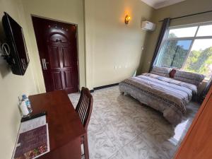 Postel nebo postele na pokoji v ubytování PHYLLEN HOTEL