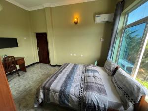 Postel nebo postele na pokoji v ubytování PHYLLEN HOTEL