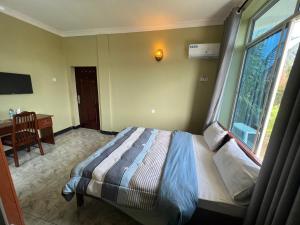 Postel nebo postele na pokoji v ubytování PHYLLEN HOTEL