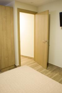 A bed or beds in a room at Apartamentos turisticos HAZ AMIGO