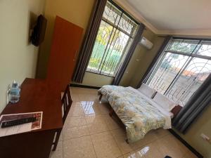 Postel nebo postele na pokoji v ubytování PHYLLEN HOTEL