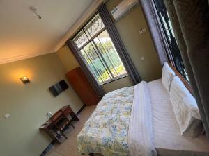 Postel nebo postele na pokoji v ubytování PHYLLEN HOTEL