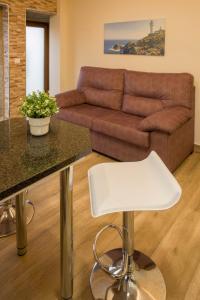 A seating area at Apartamentos turisticos HAZ AMIGO