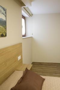 A bed or beds in a room at Apartamentos turisticos HAZ AMIGO