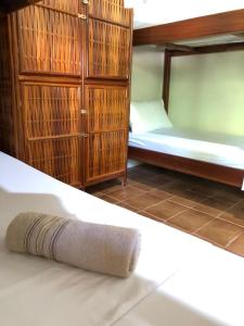 A bed or beds in a room at Pousada Carpediem