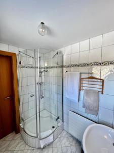 a bathroom with a shower and a sink at Wiesen Appartment in Schwarzenberg